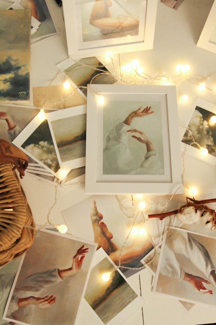 pexels-photo-3312231-3312231 A collection of artistic photo prints surrounded by glowing string lights for a warm ambiance.